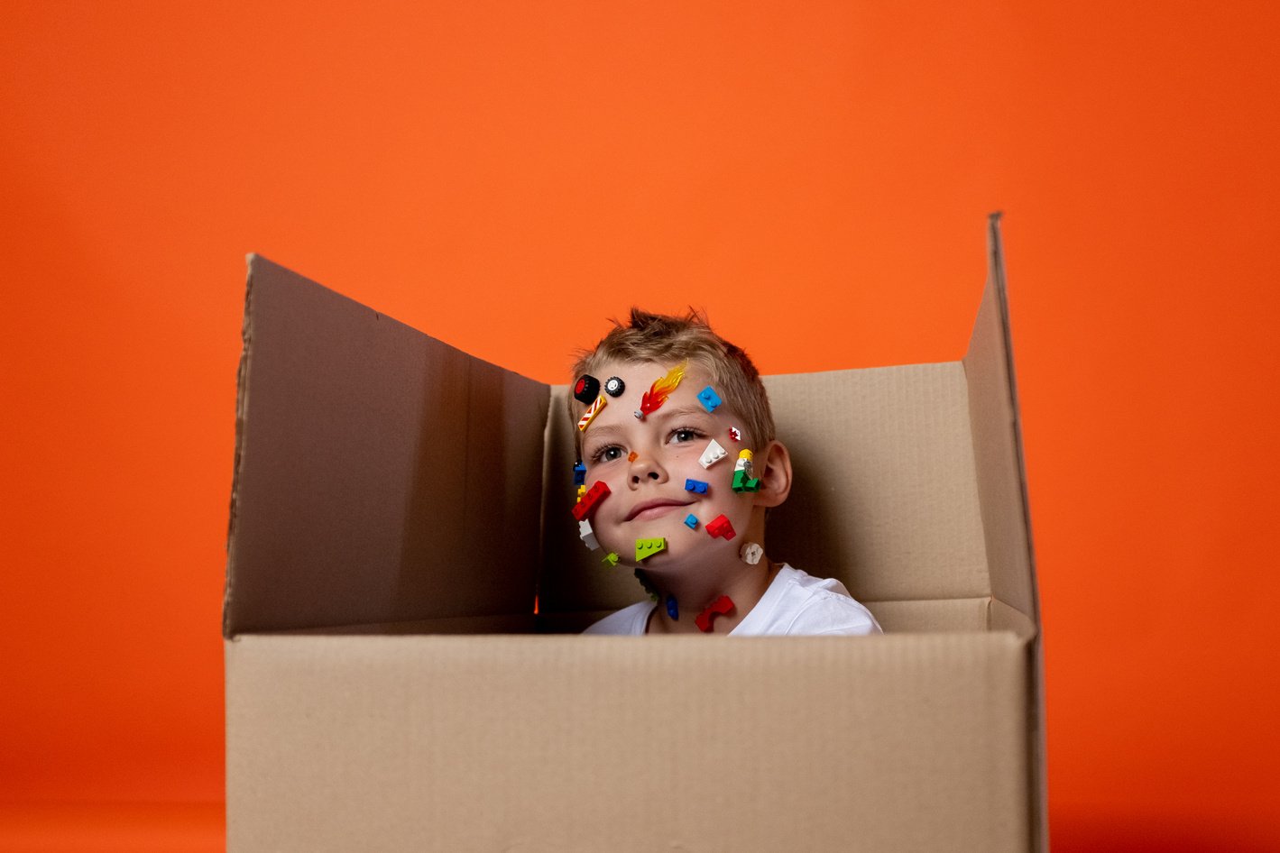 Brown Haired Doll in Brown Cardboard Box